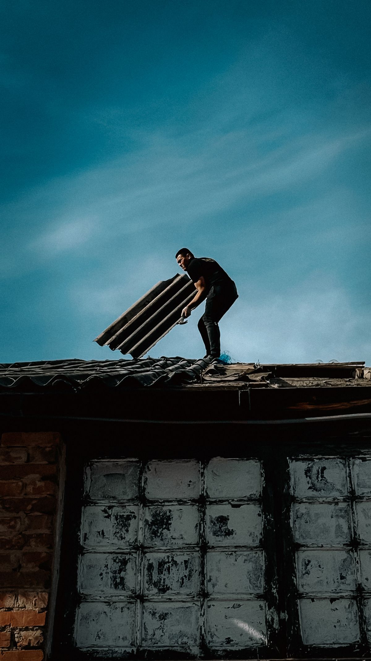 Inspector documenting roof conditions on site